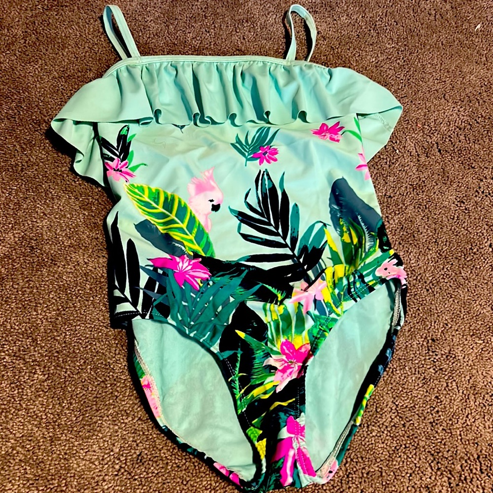One piece bathing suit old navy brand size medium girls would fit 6 or 6x.